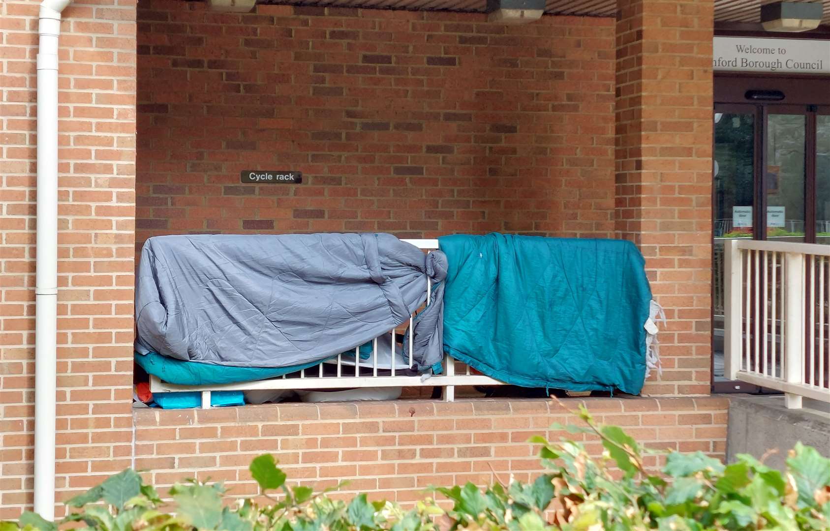 A homeless woman is camping outside the Ashford Borough Council offices