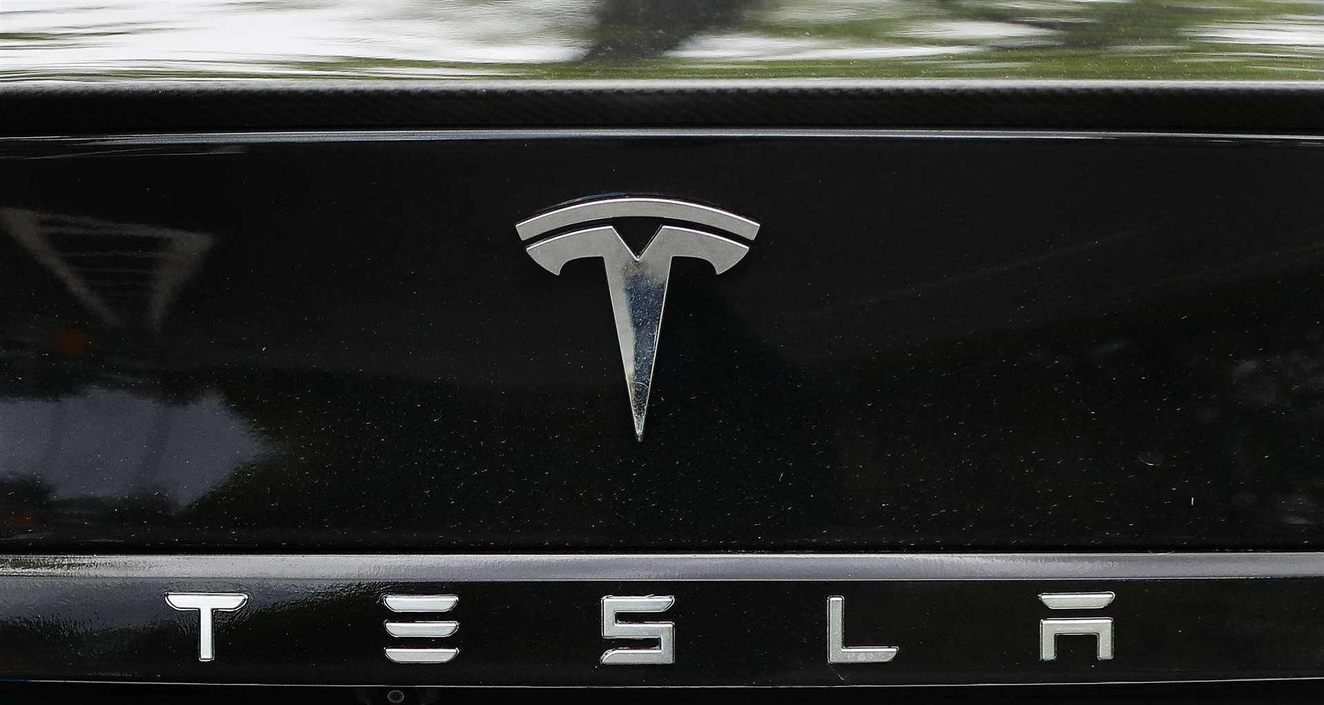 The Tesla logo (Niall Carson/PA)