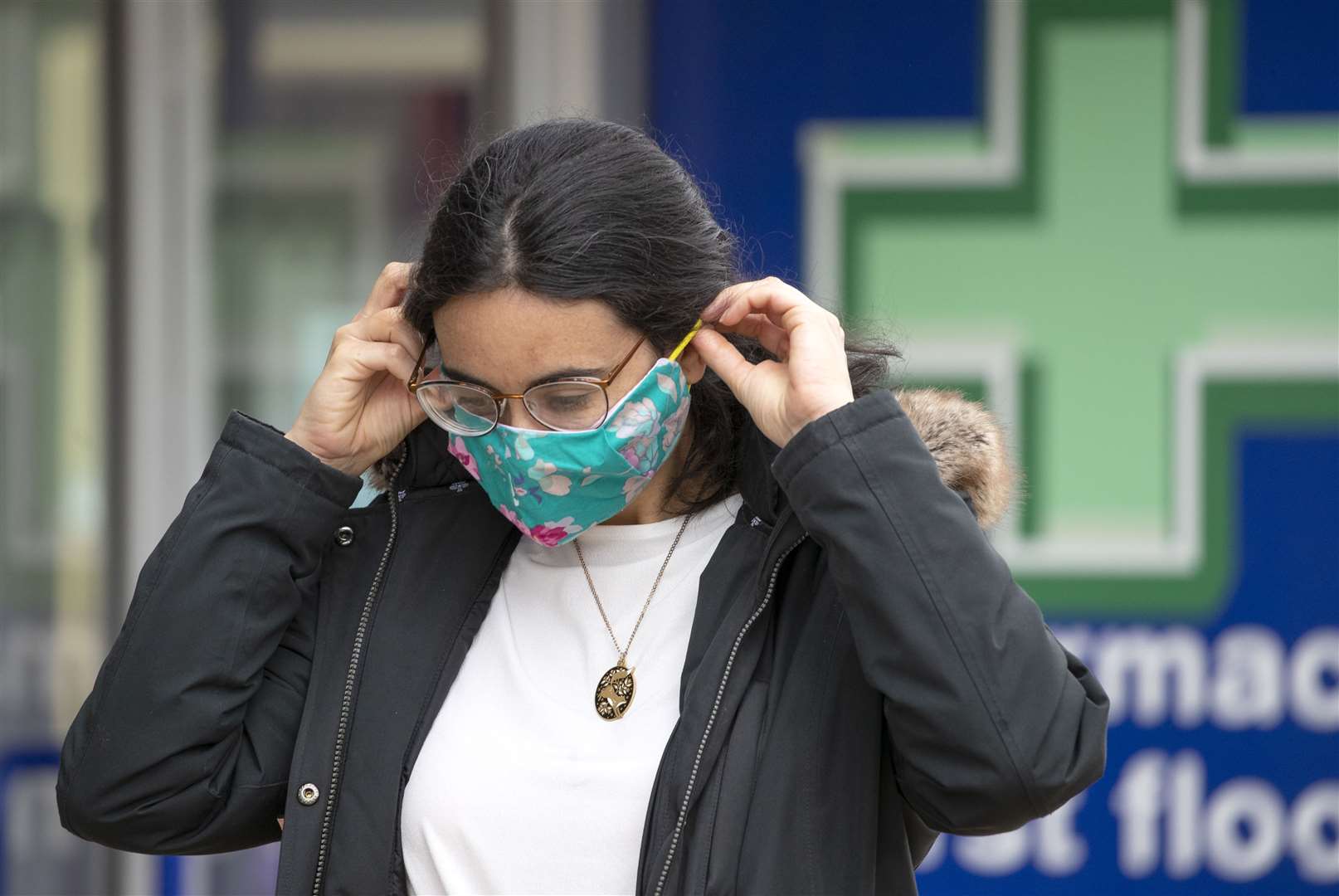 A shopper wears a protective face mask in Edinburgh (Jane Barlow/PA)