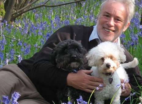 Philip Cole with his dogs Rocky, left, and Shandi, right