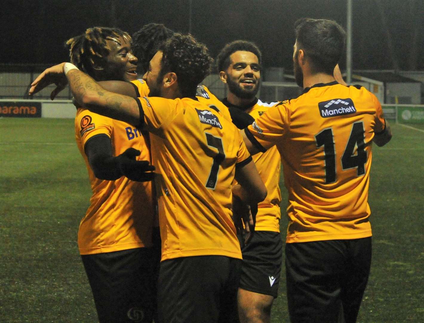 Christie Pattisson, left, joins the celebrations after Ibrahim Olutade's goal against Poole Picture: Steve Terrell