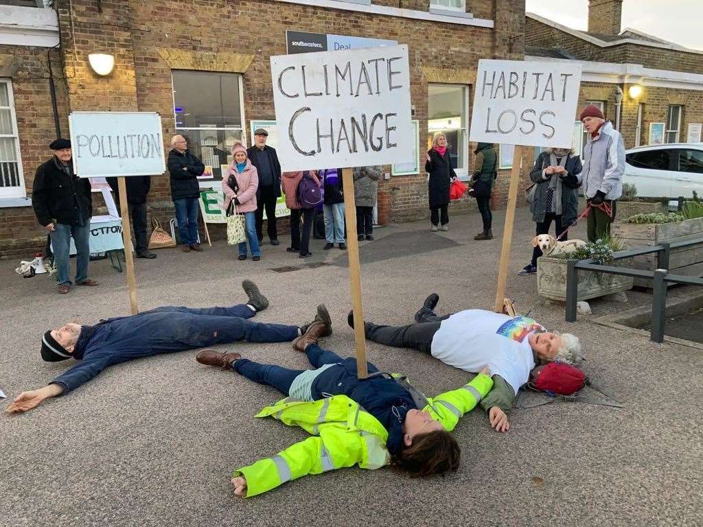 Demonstrators laid down on the pavement outside Deal Railway Station on Friday