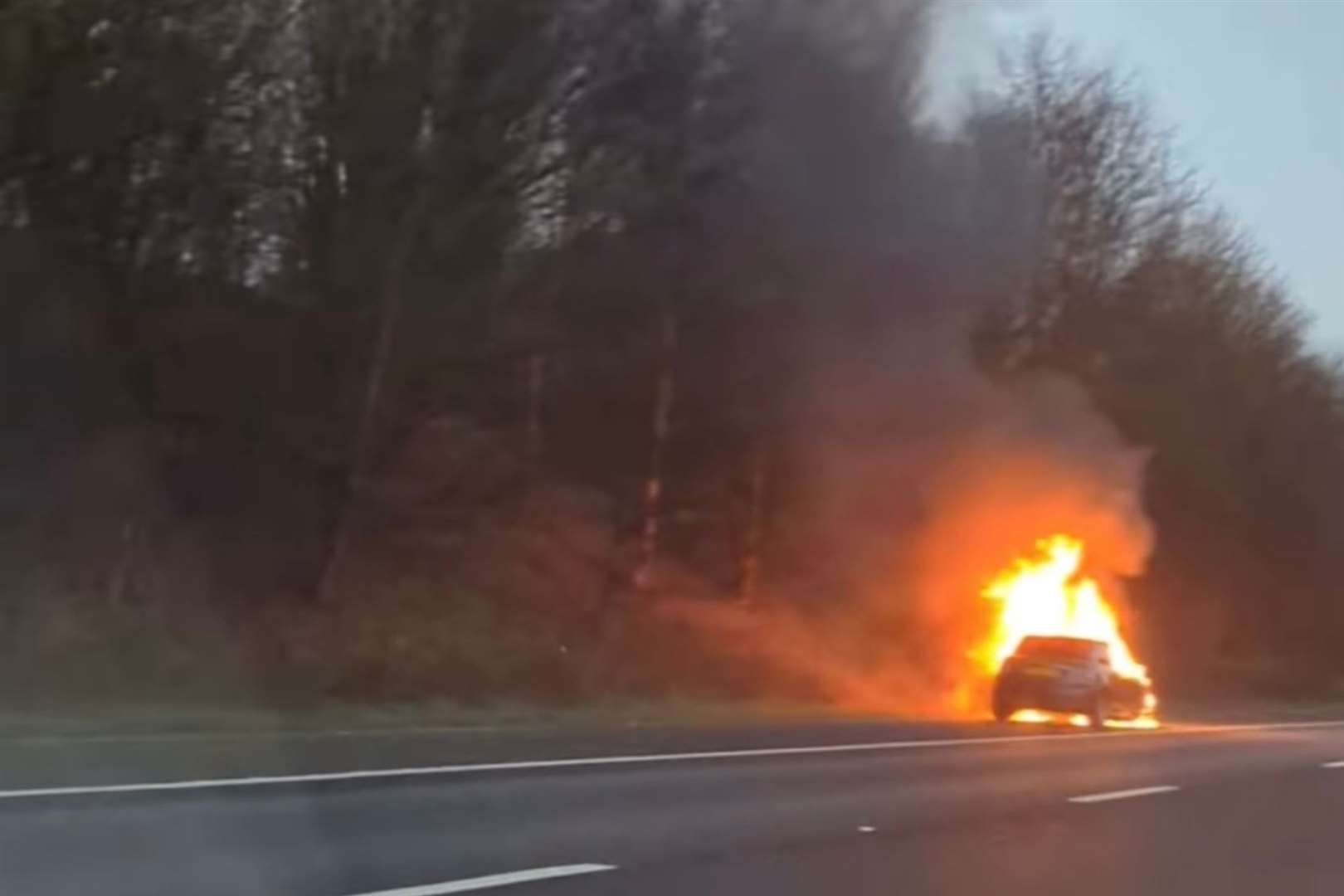 A passenger who went past the car said it was "engulfed in flames". Picture: Justin Brazill