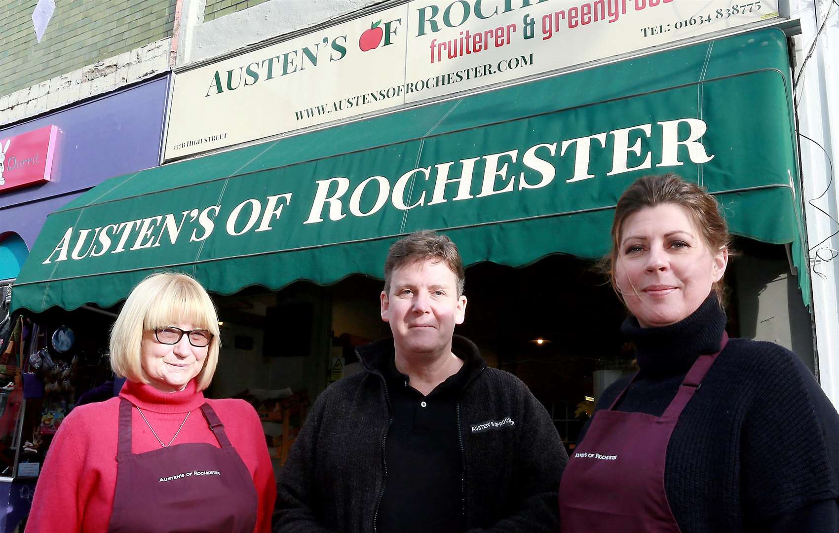 Andy Austen, with staff members Carol Austen, left and Kim Forbes, right