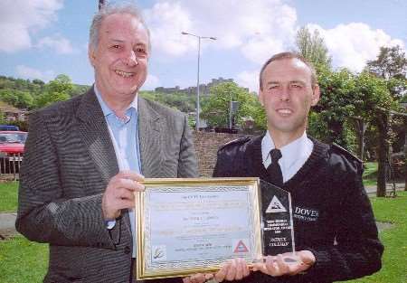 Patrick Coleman (right) receives his award from Peter Fry, direcrtor of the CCTV Users Group. Picture courtesy Dover District Council