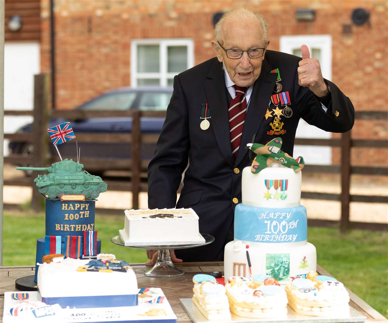 Captain Sir Tom with birthday cakes as he celebrated his 100th birthday (Emma Sohl/Capture the Light Photography/PA)