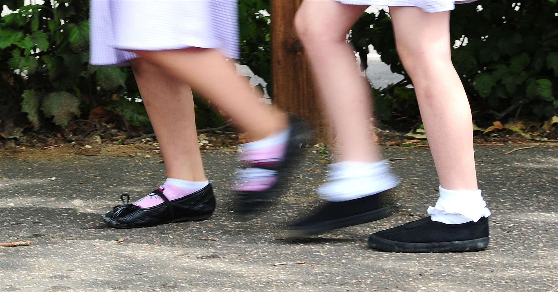 Schoolgirls walking to school (Ian West/PA)