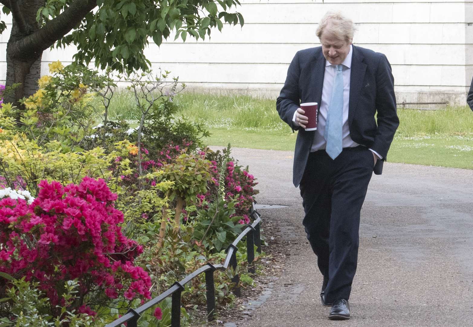 Boris Johnson takes a morning walk in St James’ Park (PA)