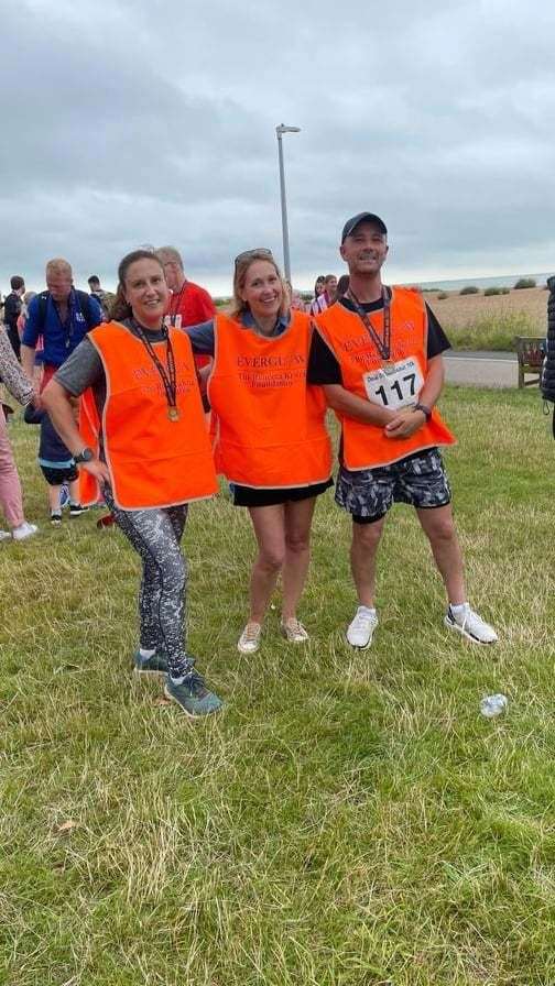 Hamilton Phipps, Claire Bond and Kate Kruza with their medals after running the Dinosaur 10k at Deal on Sunday