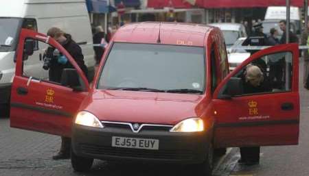 Police inspect the van which had its windows smashed. Picture: GRANT FALVEY