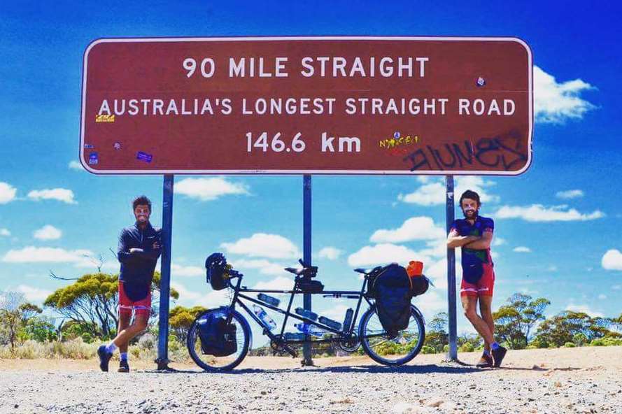 The Tandem Men, John Whybrow (left) and George Agate preparing to head out on Australia's longest straight road.