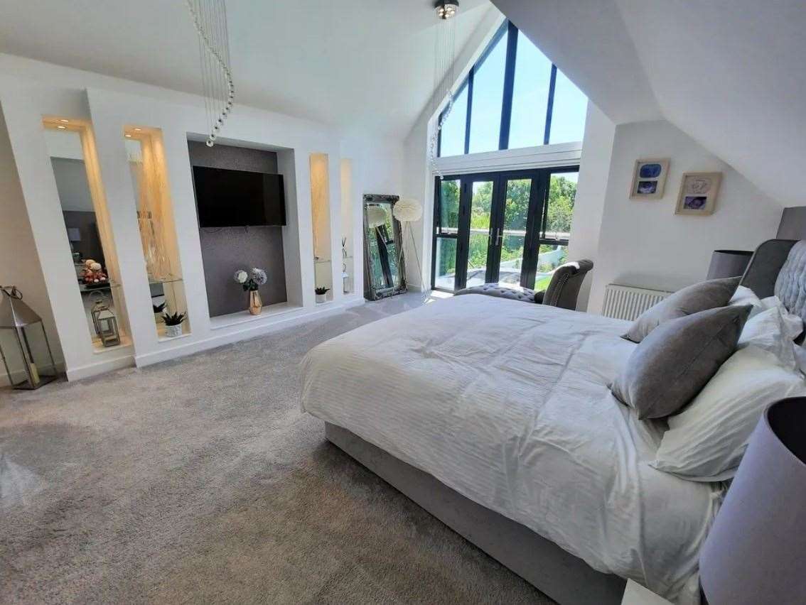 The main bedroom with cathedral-style window. Picture: Zoopla / Machin Lane Partnership