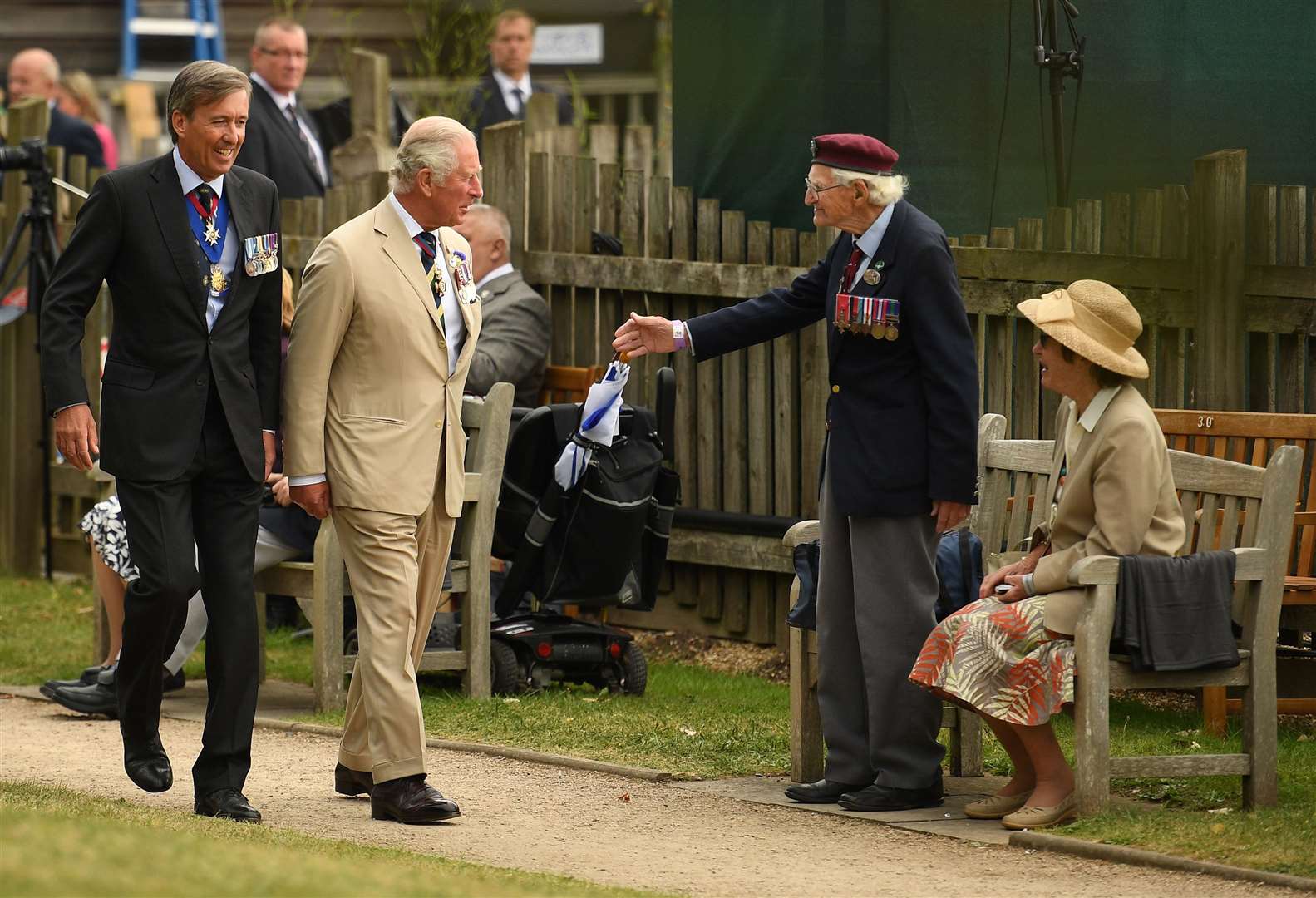 A veteran stands to greet the Prince of Wales (Oli Scarff/PA)