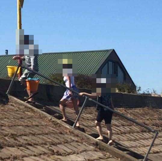 Groups of shellfish pickers spotted on the beach in Grain on Sunday has sparked concerns it is "raping and pillaging" the ecosystem. Picture: Becky Craggs