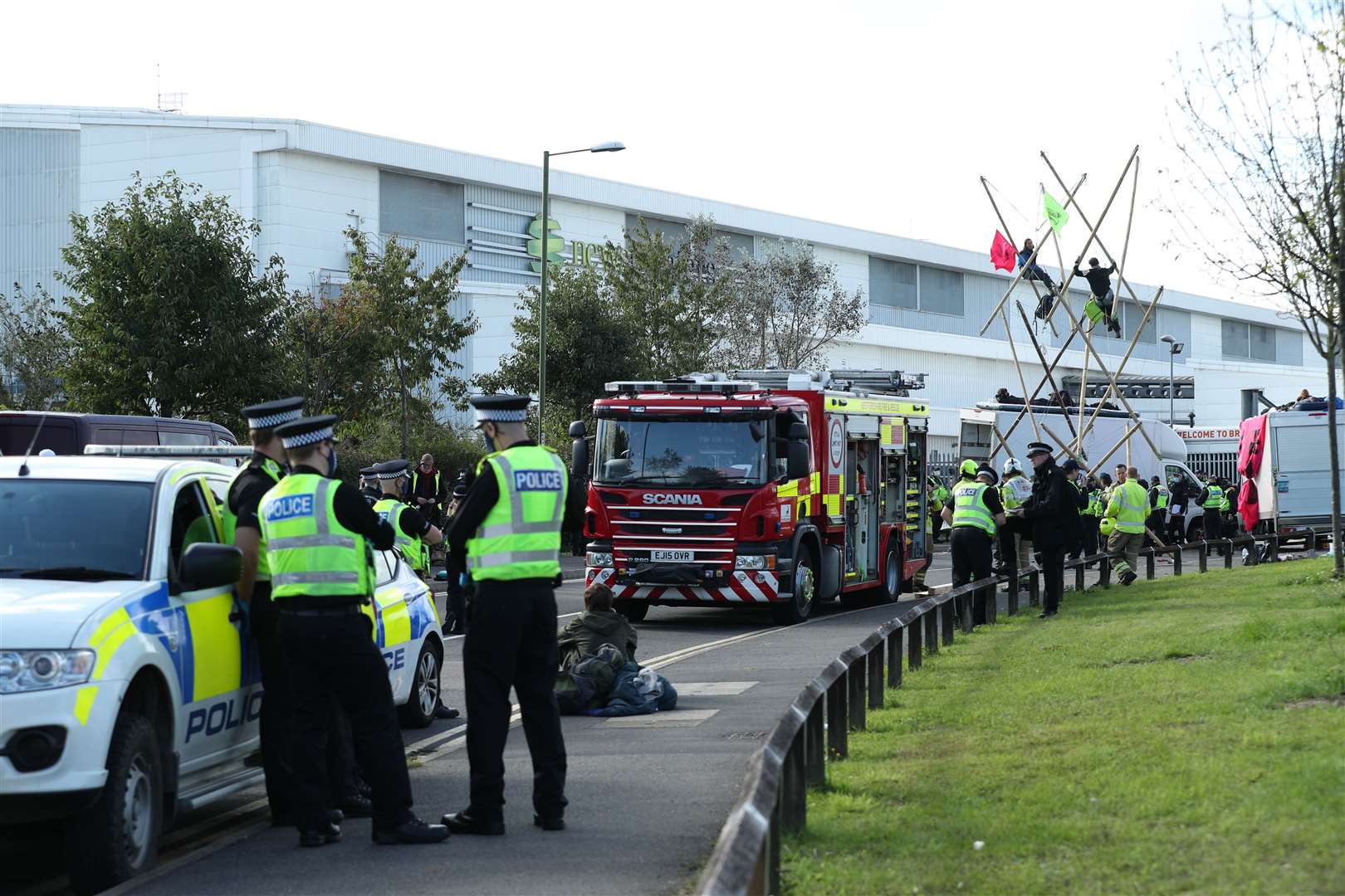 Police and fire services outside the Newsprinters printing works (Yui Mok/PA)