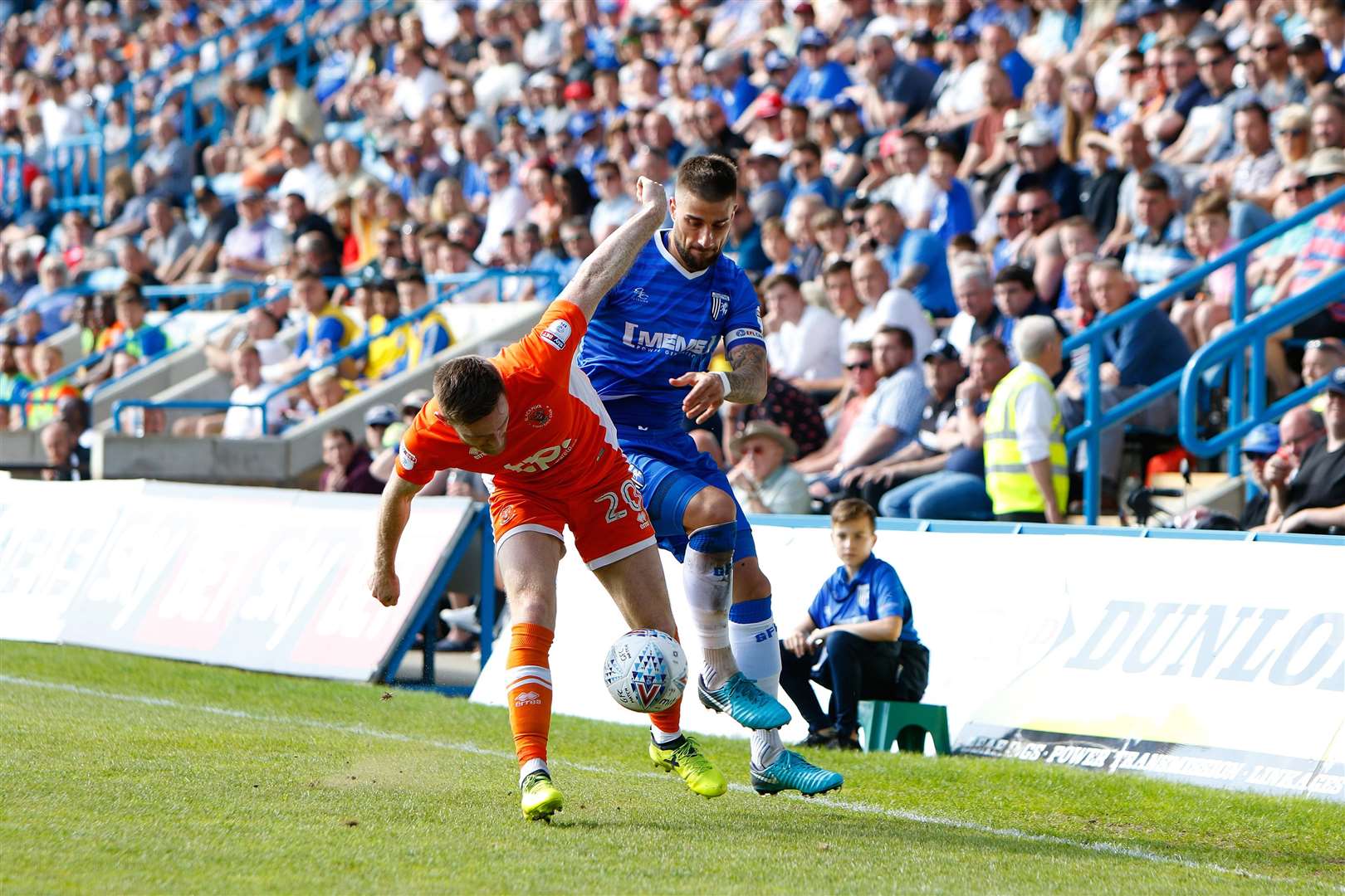 Gillingham defender Max Ehmer challenges Blackpool defender Oliver Turton Picture: Andy Jones