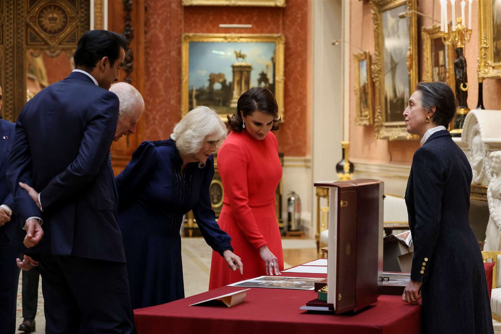 The King and Queen with the Emir of Qatar Sheikh Tamim bin Hamad Al Thani (left) and his wife Sheikha Jawaher (right) at a display of Qatari items from the Royal Collection at Buckingham Palace (Mina Kim/PA)