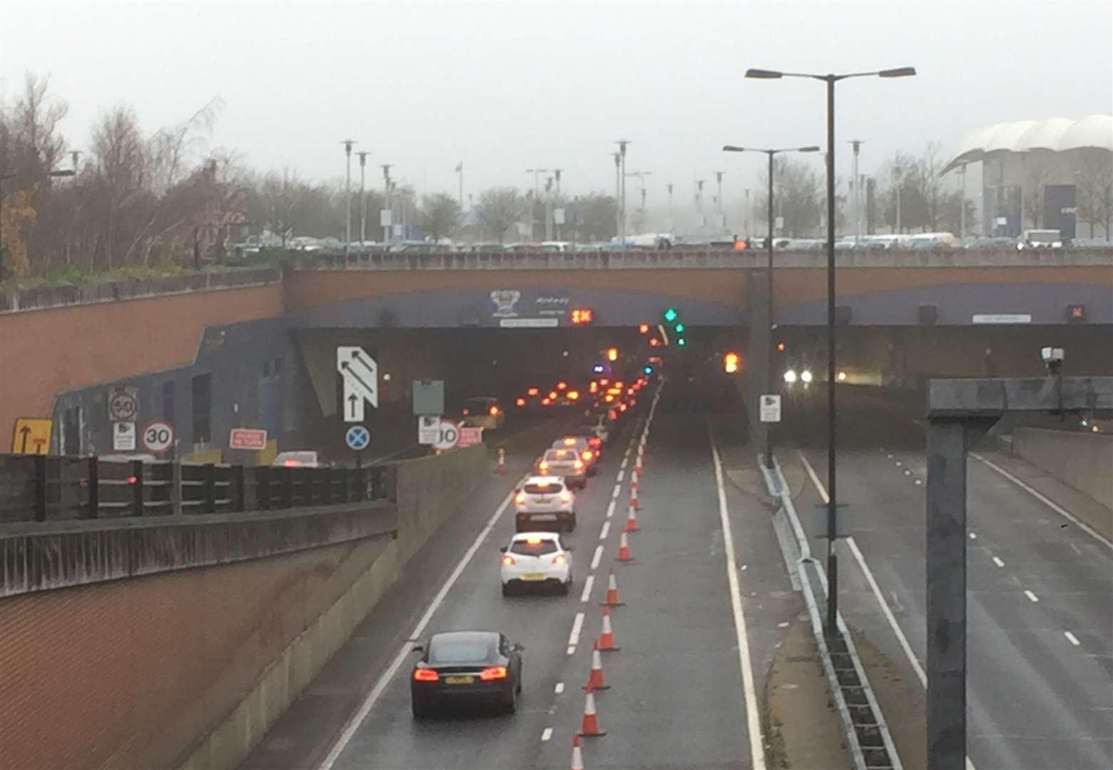 Queues at the Medway Tunnel after a two-car accident left three people needing hospital treatment