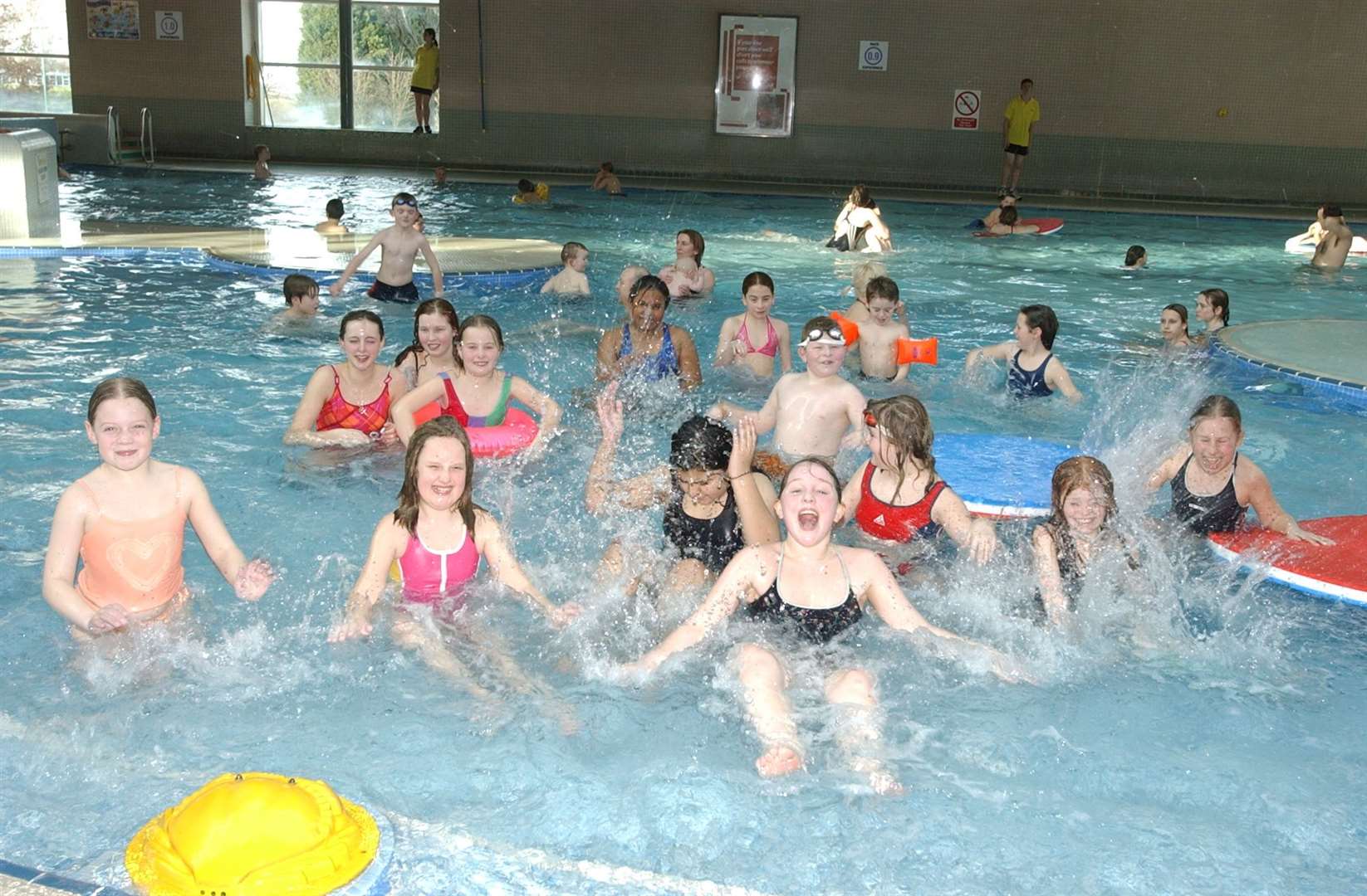 Customers enjoying the pool when it re-opened after repairs in 2003
