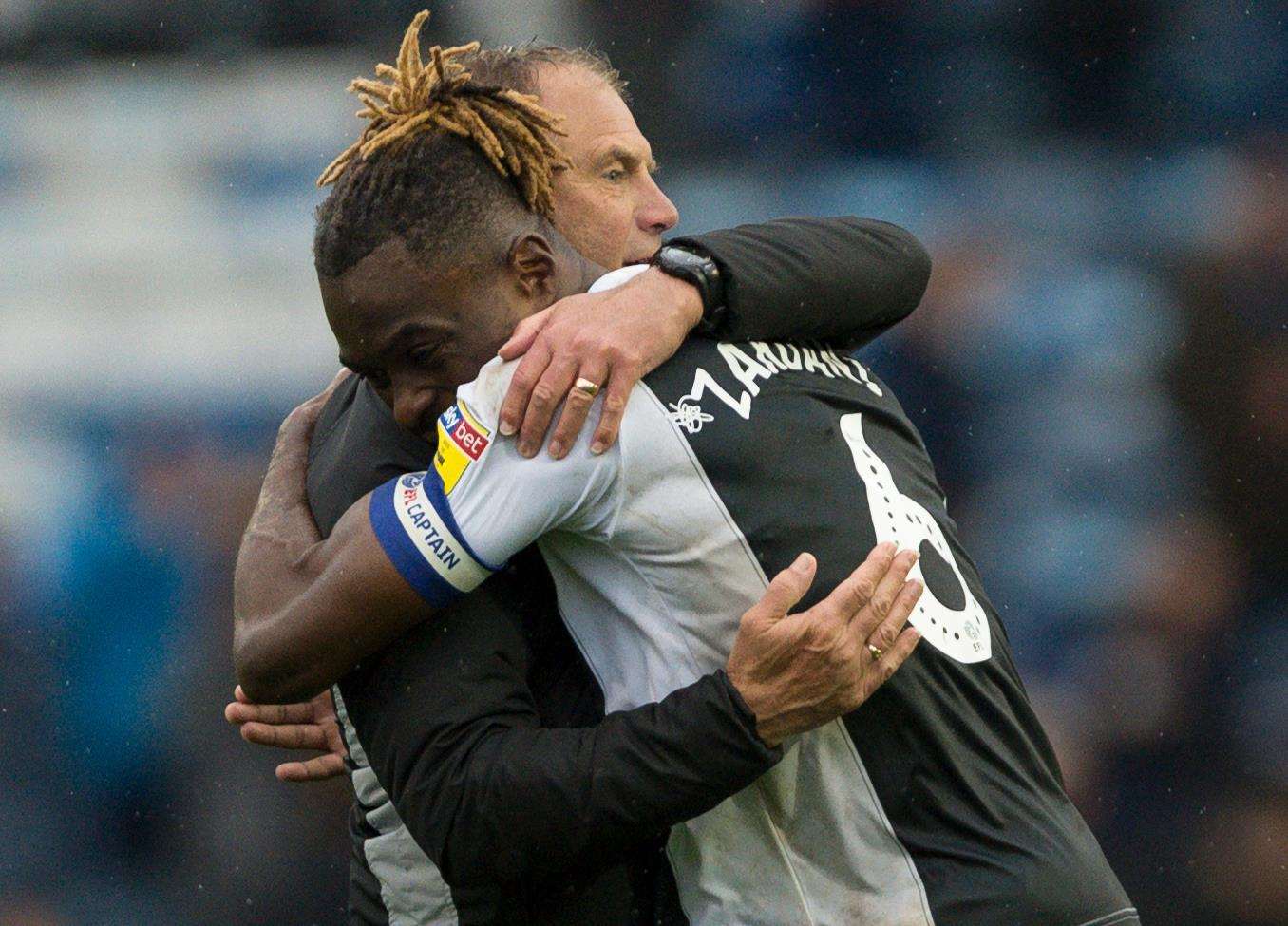 Manager Steve Lovell celebrates Gills' win on Saturday with skipper Gabriel Zakuani Picture: Ady Kerry