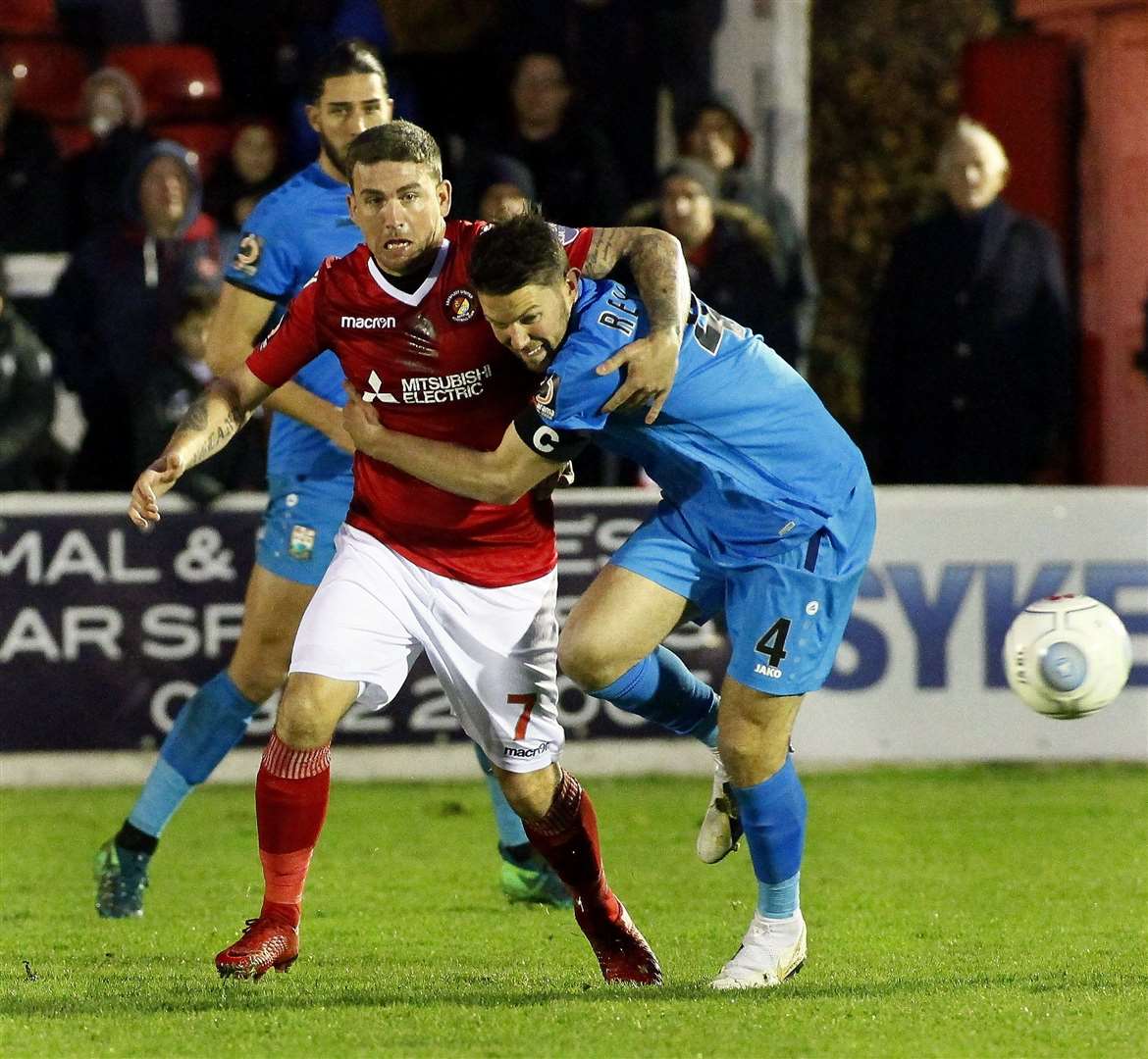 Cody McDonald battles for possession against Barnet Picture: Sean Aidan