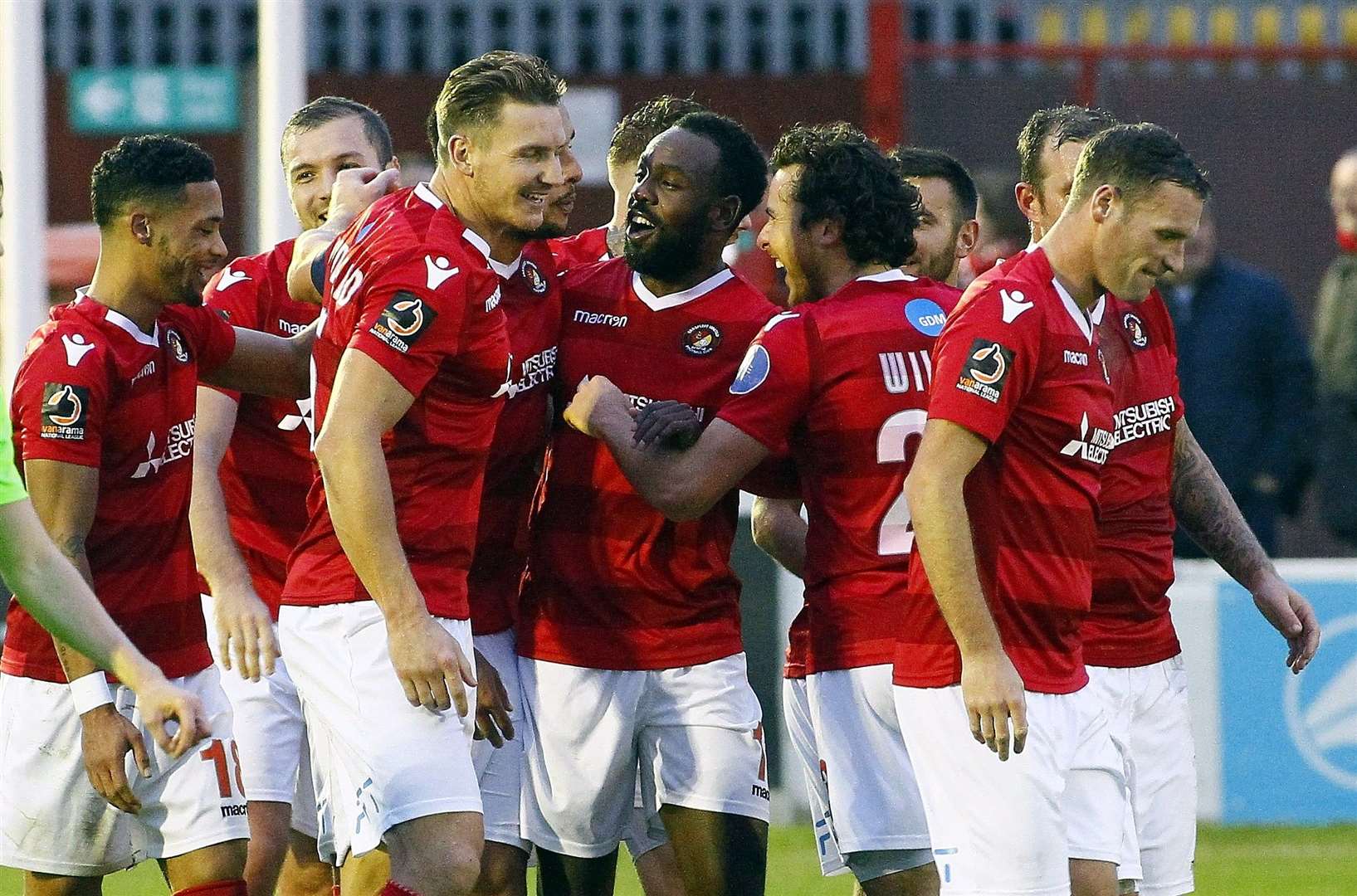 Chris Bush is mobbed after scoring his free-kick against Halifax Picture: Sean Aidan