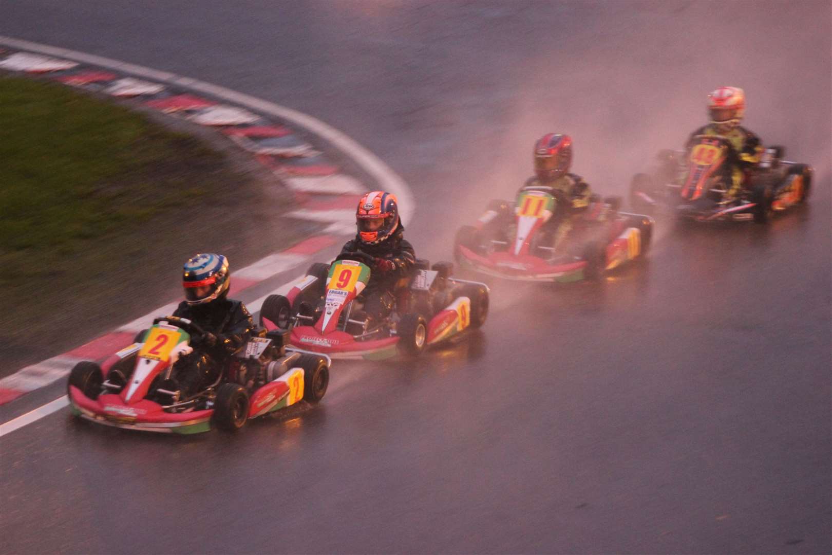Young racers approach Cafe Curve during the circuit's wet 50th anniversary meeting in October 2013. Picture: Joe Wright