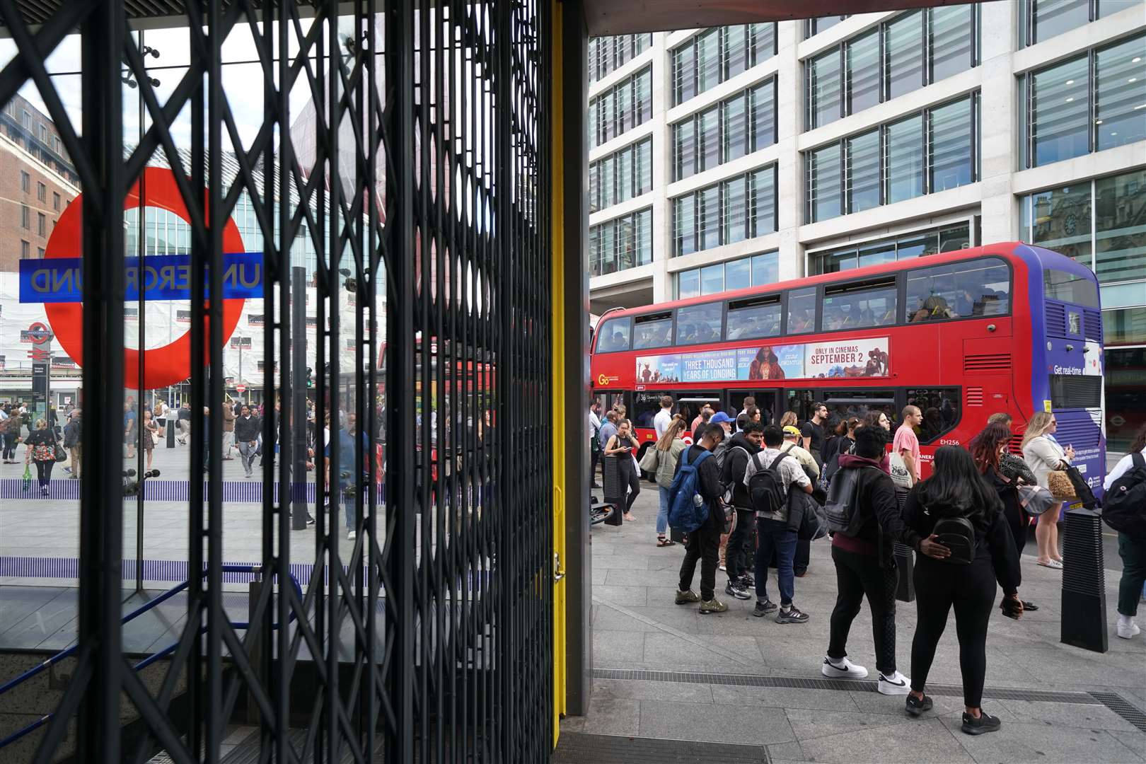 People waiting for buses outside Victoria station in central London (Kirsty O’Connor/PA)