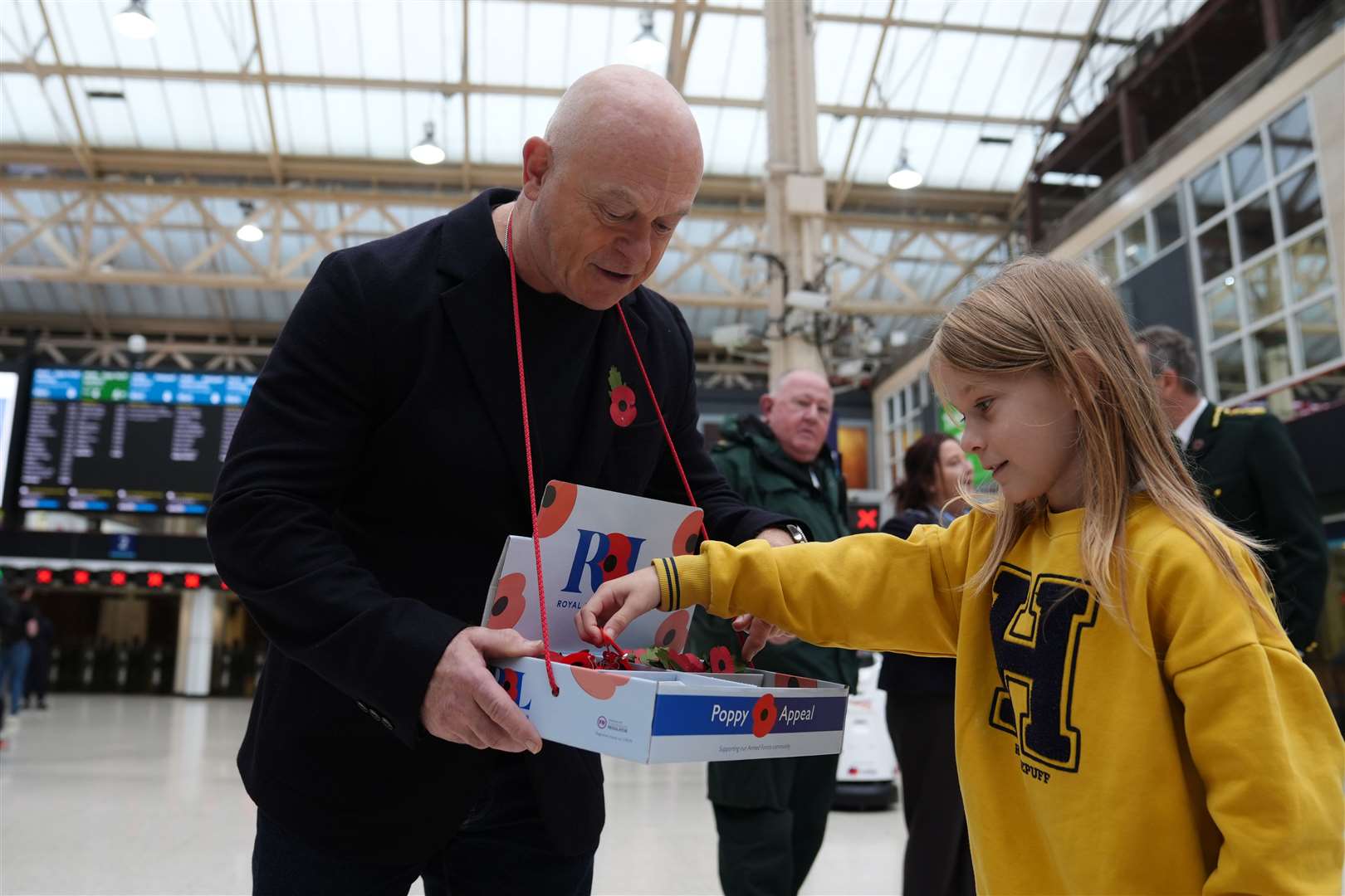 Ross Kemp selling poppies at Charing Cross Station (Ben Whitley/PA)