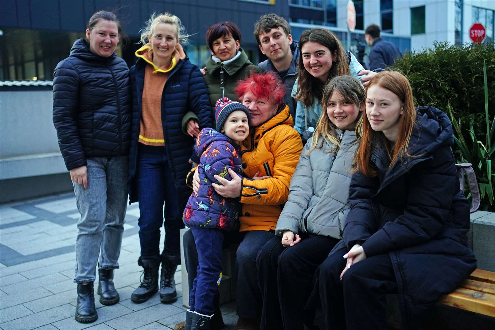 Callum Clarke (back row, second right) and his wife Vitalina (back row, right) are reunited with her family (Victoria Jones/PA)