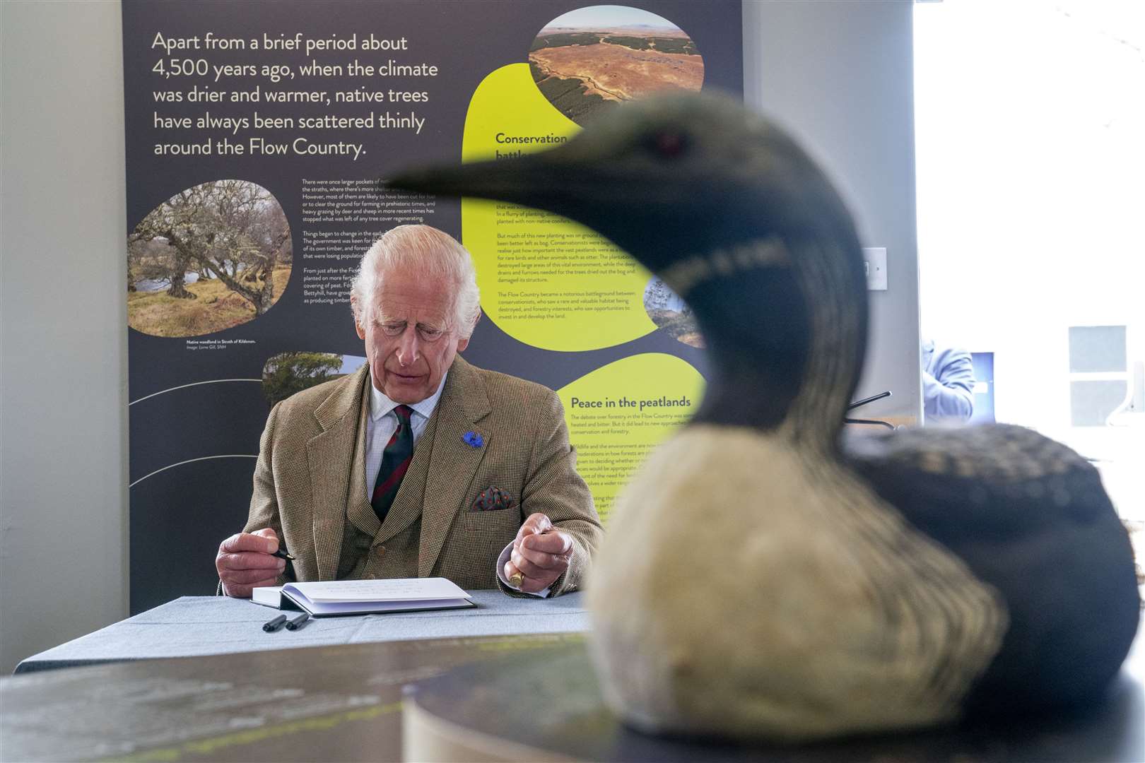 Charles signed the visitor book at Forsinard Flows Visitor Centre (Jane Barlow/PA)