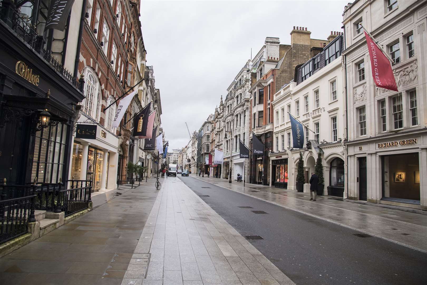 Lockdown has seen streets deserted and shoppers reducing credit card debts, according to EY (Ian West/PA)