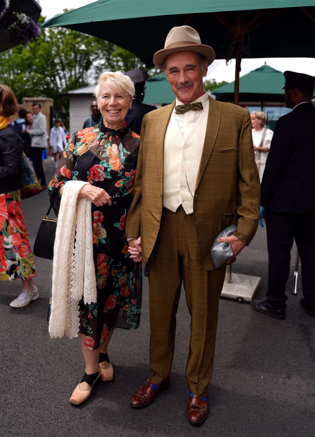 Sir Mark Rylance and Claire van Kampen arrive on day eight of the 2024 Wimbledon Championships (Jordan Pettitt/PA)