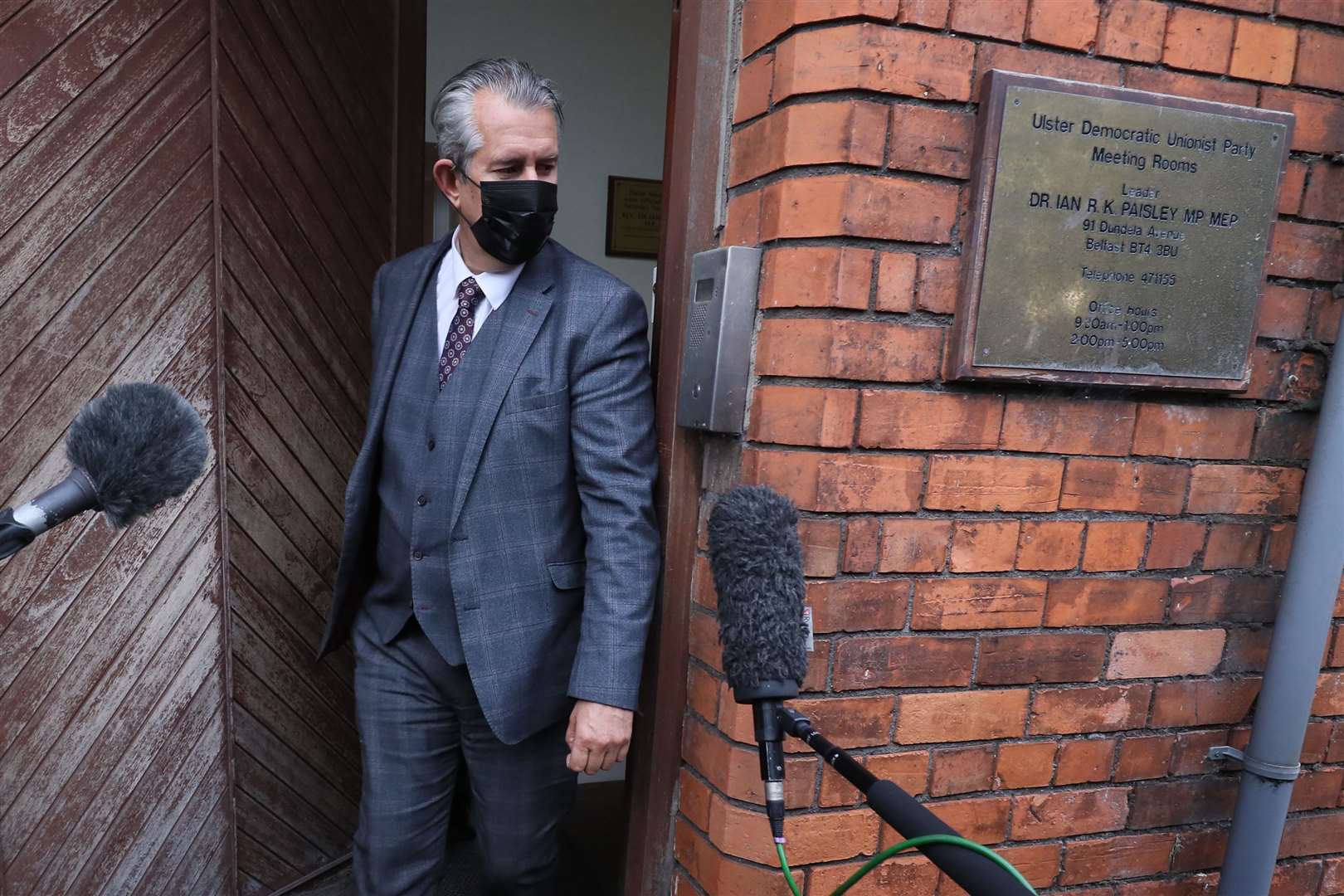 Edwin Poots leaves the DUP headquarters in Belfast (Brian Lawless/PA)