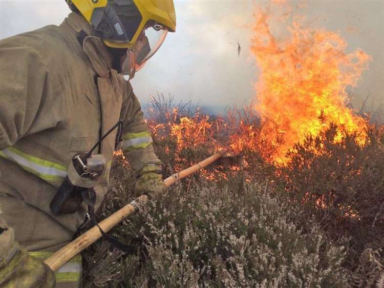 Firefighters are tackling a haystack blaze