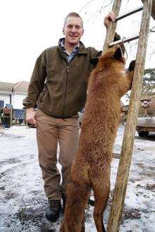 Keith Talbot next to the giant fox