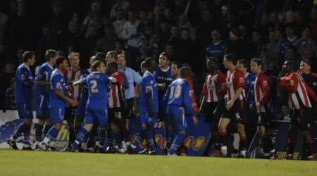 Gillingham and Brentford players confront each other at Priestfield