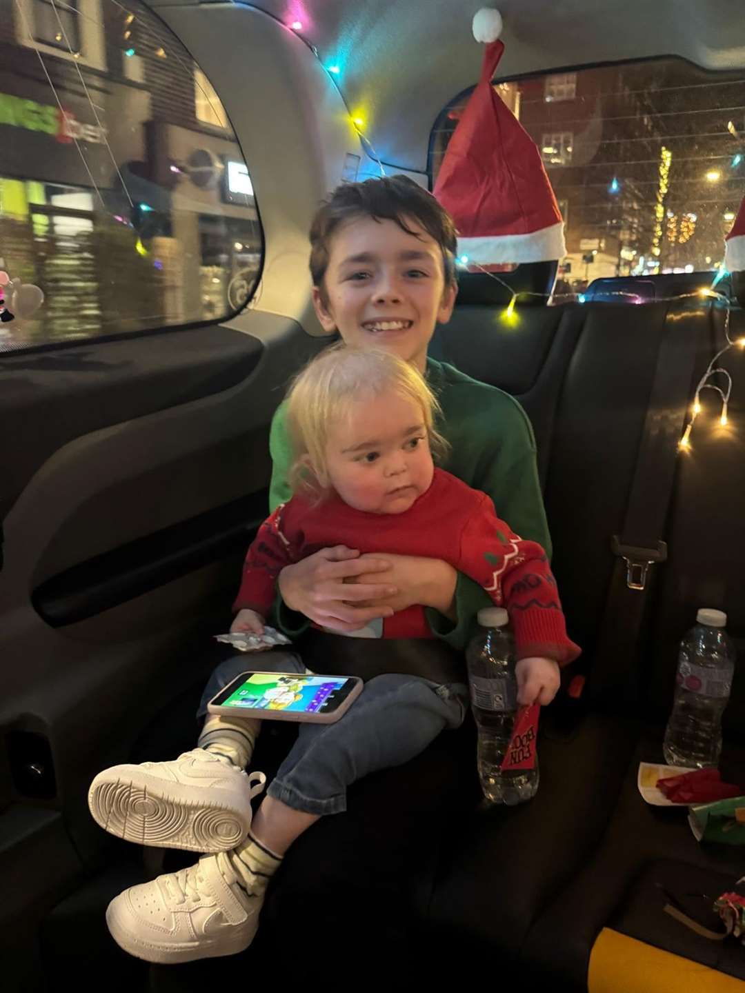 Teddie and Alfie enjoyed seeing central London’s Christmas lights from the black cab (Handout/PA)