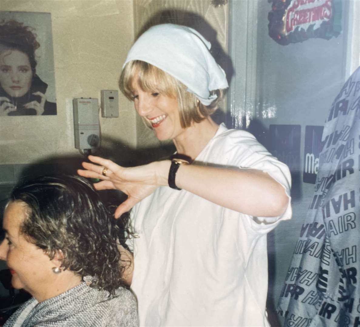 Undated photo of Janette cutting hair while dressed up for Christmas. Picture: Janette Miller