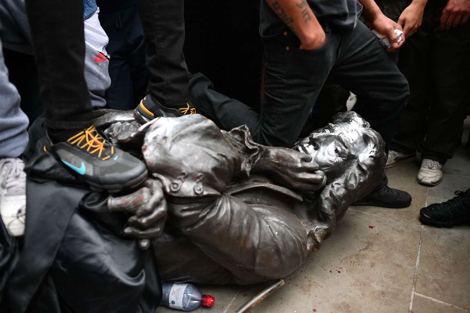 Protesters pull down a statue of Edward Colston during a Black Lives Matter protest rally in College Green, Bristol (Ben Birchall/PA)