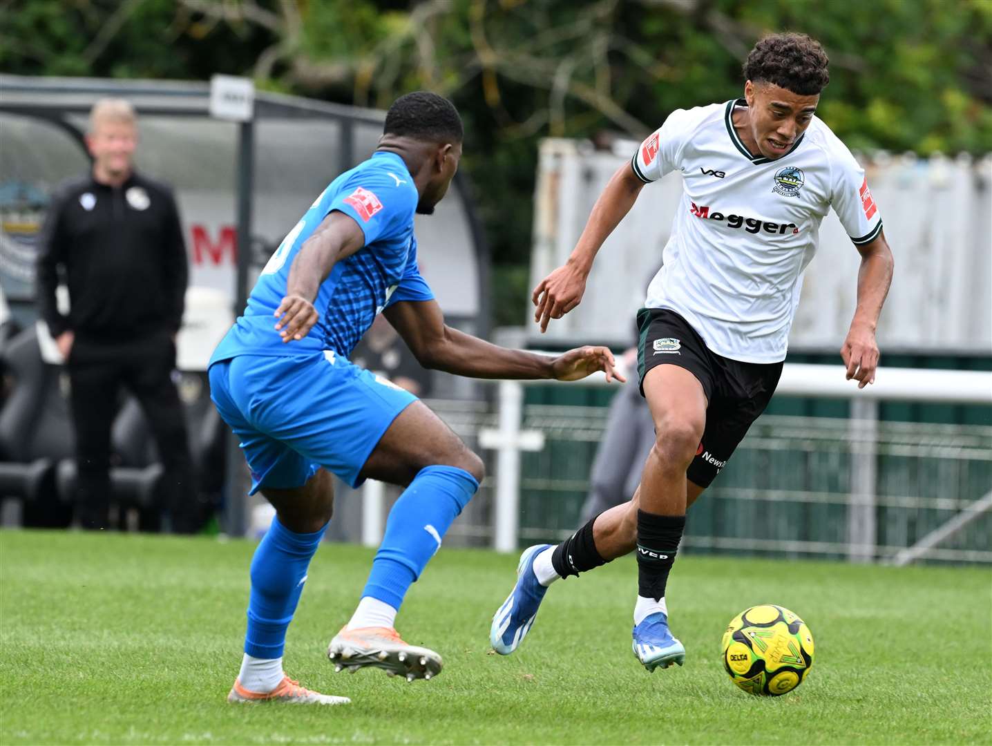 Dover’s Luke Baptiste. takes on Dartford full-back Sam Okoye. Picture: Barry Goodwin