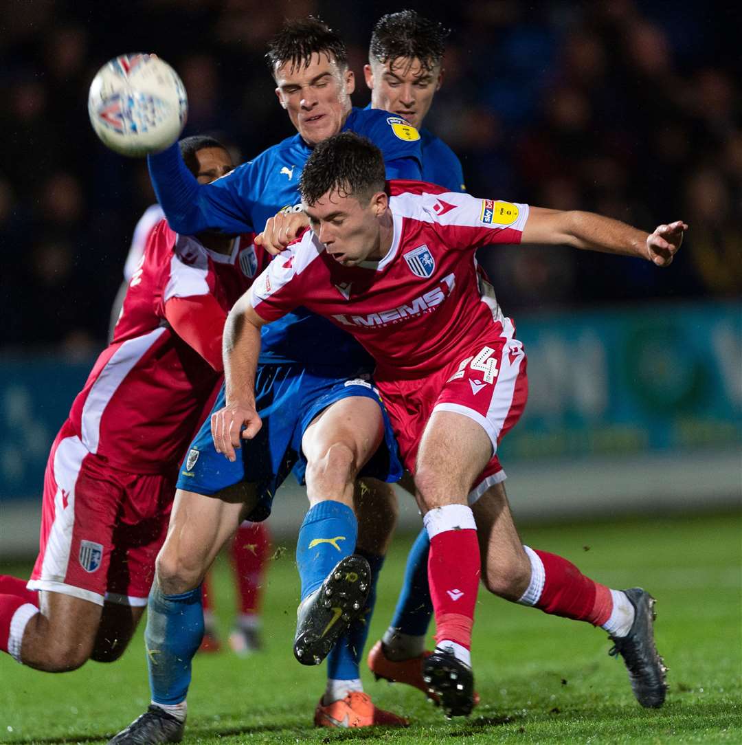 Tom O'Connor is challenged by Wimbledon's Ryan Delaney on Saturday Picture: Ady Kerry