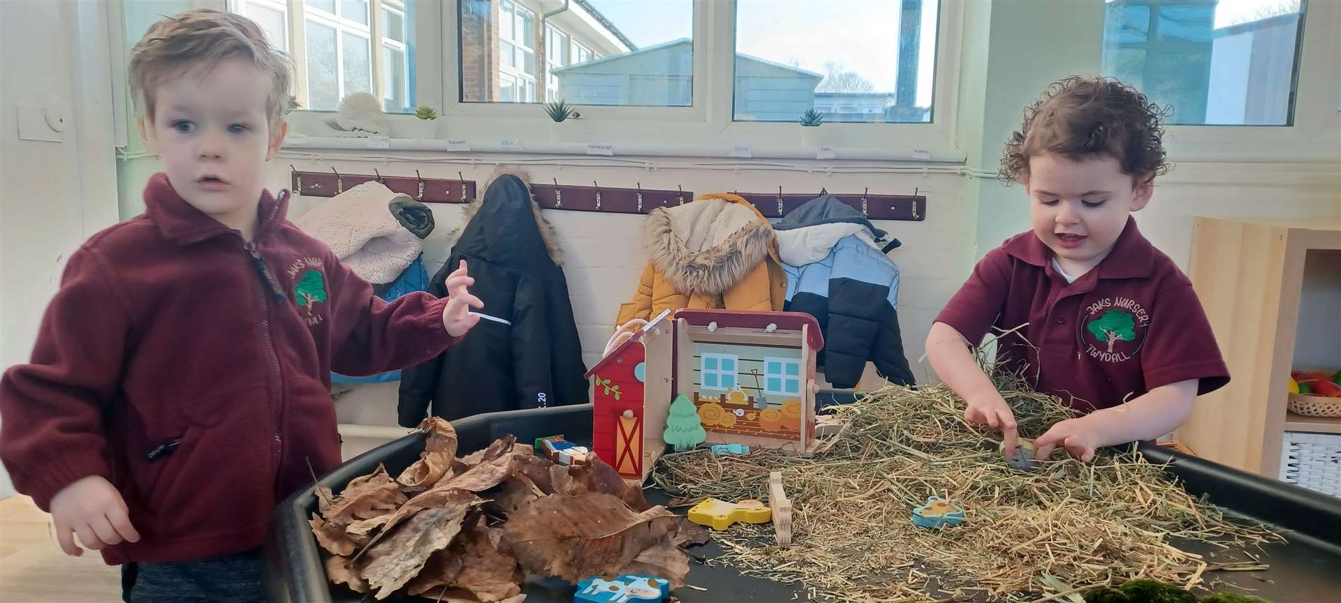 Children at JAKS enjoy a farm scene on the play table