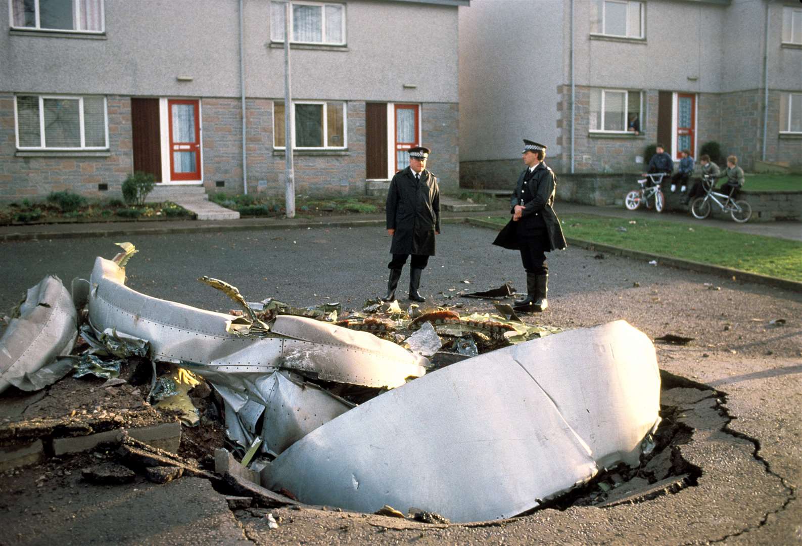 Police officers stand among debris left in the Scottish town of Lockerbie (PA Archive)