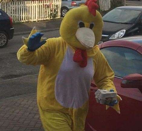 Keeping spirits up... the giant chicken delivering food to villagers