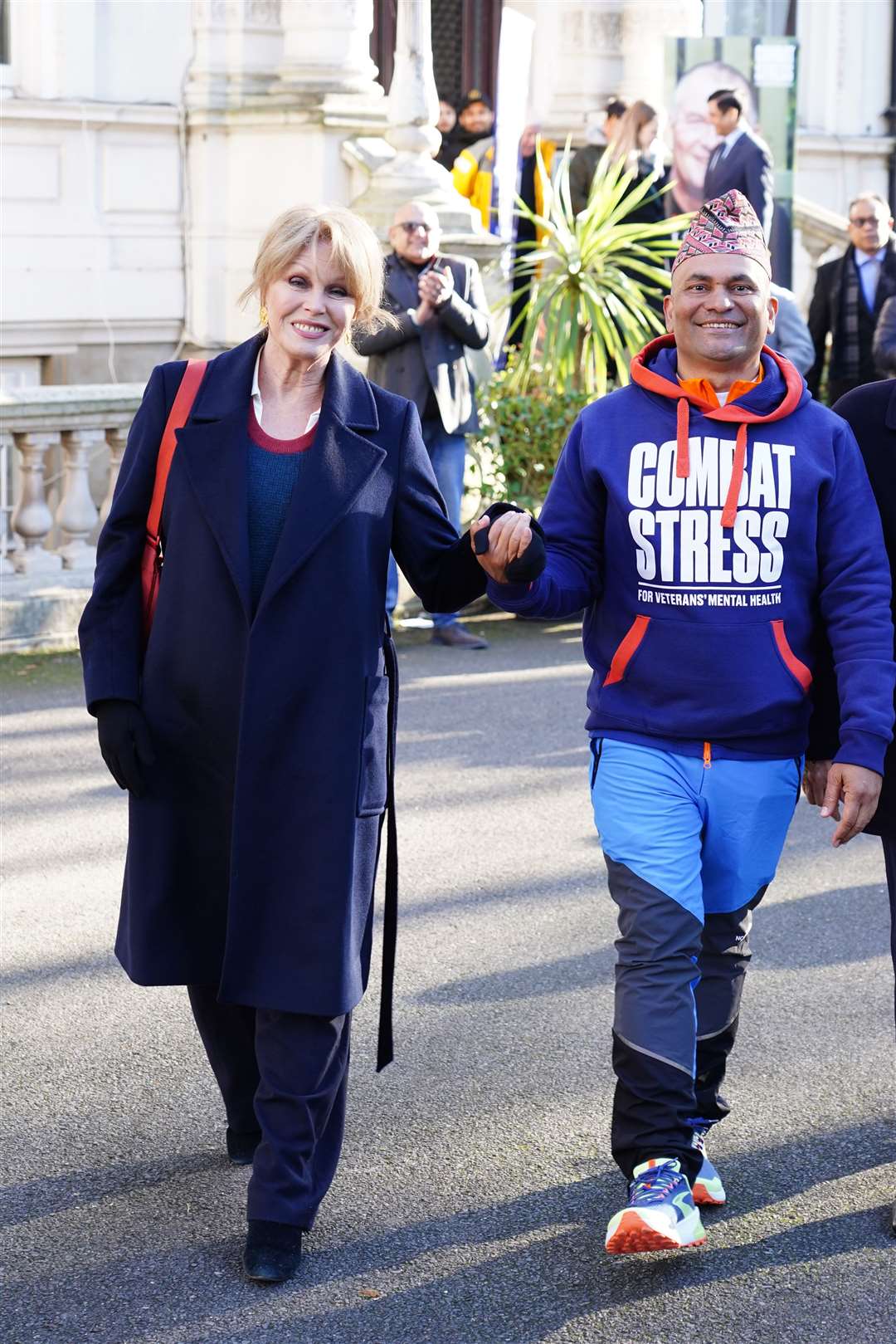 Dame Joanna with restaurant owner Sujan Katuwal (Ian West/PA)