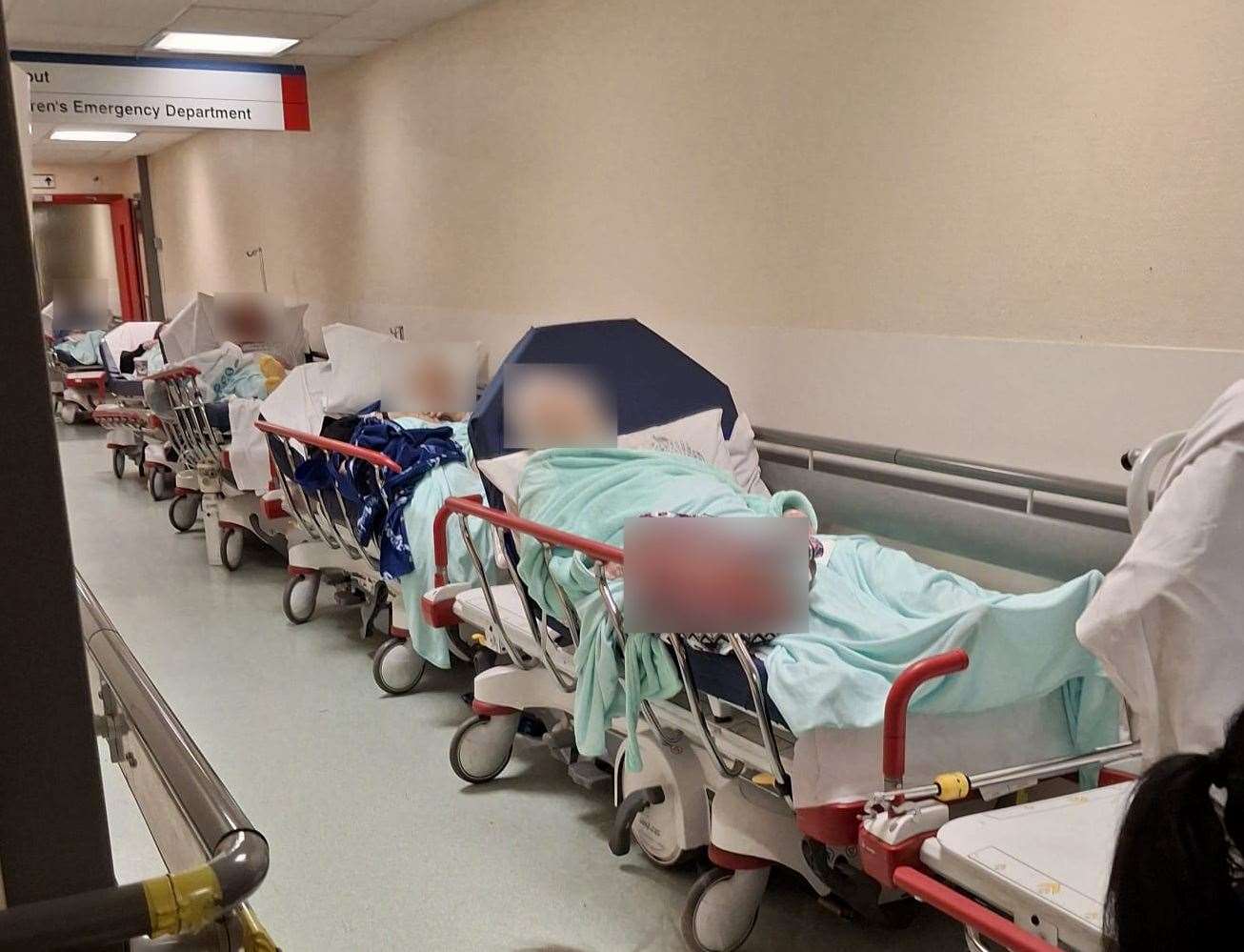 Alarming pictures shared with KentOnline show beds filled with patients lining the corridors of the William Harvey's A&E department