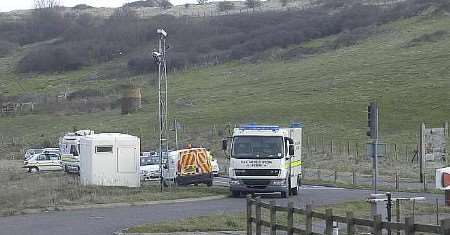 ALERT: Police vehicles block off the entrance to Samphire Hoe. Picture: DAVE DOWNEY