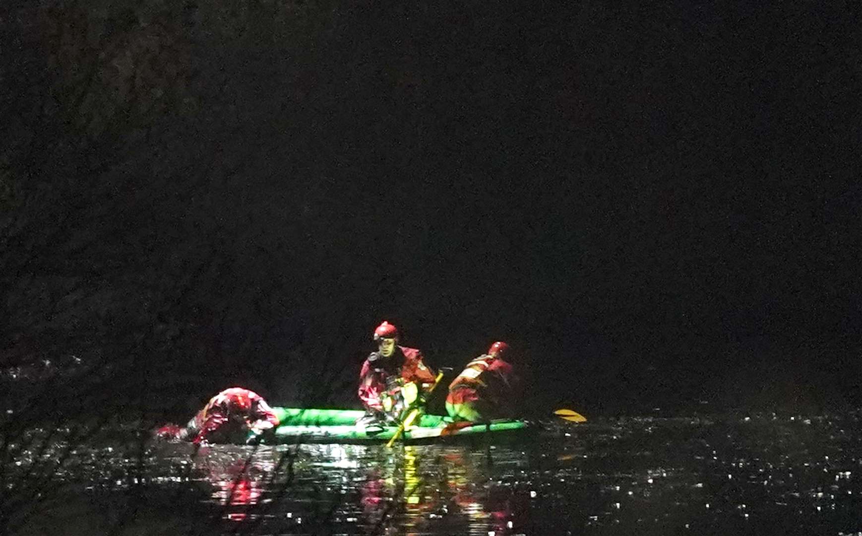 Emergency personnel search the lake on Sunday (Jacob King/PA)