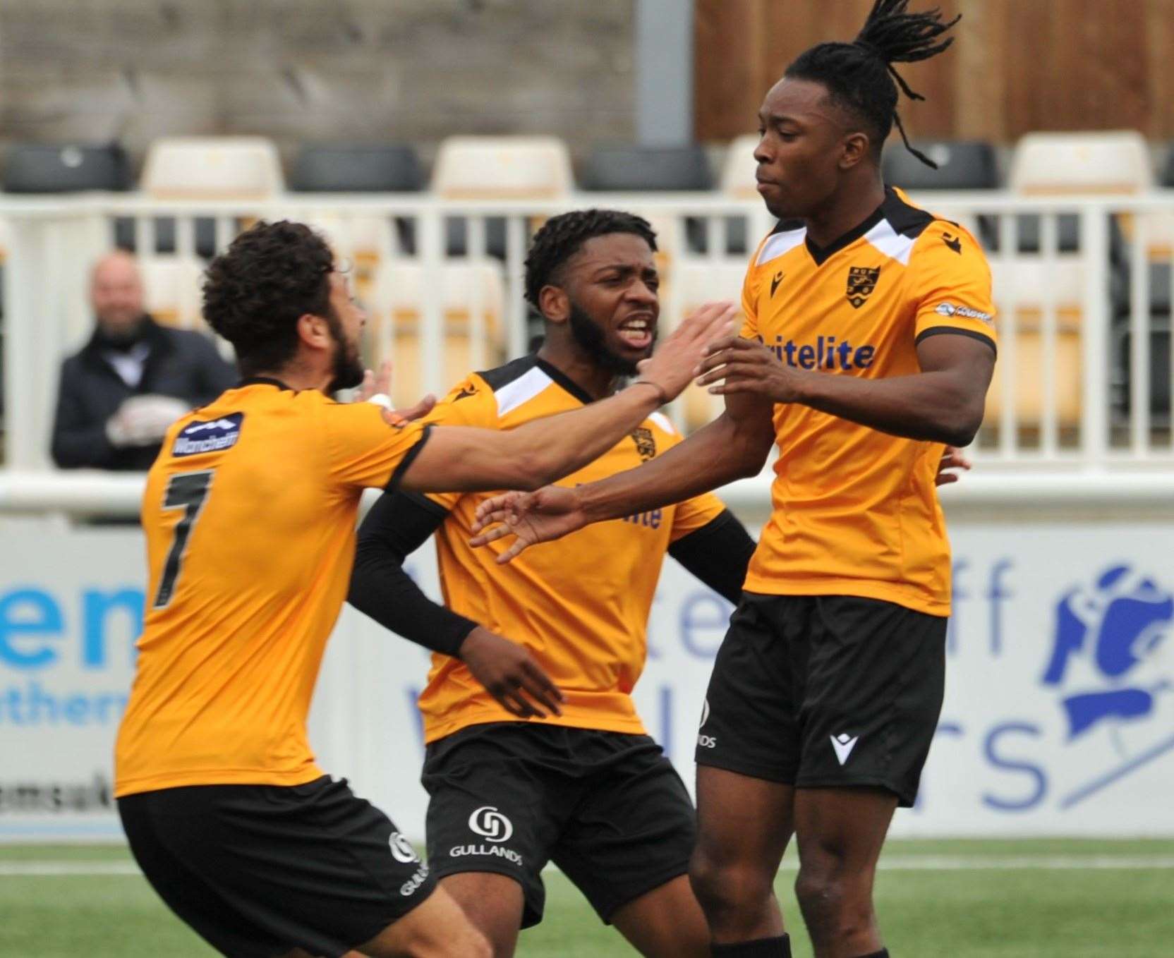Raphe Brown, right, is congratulated on his first Maidstone goal by George Porter and Dominic Odusanya Picture: Steve Terrell